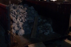 We had to remove the concrete by hand and load it in to this dumpster because there was not enough room for other machines on the site to remove debri