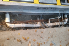 Setting the barrier, tying in the drain, installing rebar, and tying in the conduit