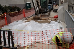 Covering the barrier in case of bad weather, and laying down plywood to divert water around edges in case of a storm